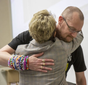 MU College of Veterinary Medicine Dean Carolyn Henry congratulates Associate Professor of Biomedical Sciences Christopher Baines after he is announced as the first recipient of the 2022 William T. Kemper Fellowship for Teaching Excellence.