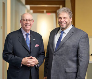 Siteman Cancer Center director Timothy J. Eberlein (left), MD, the Spencer T. and Ann W. Olin Distinguished Professor and Senior Associate Dean for Cancer Programs at Washington University School of Medicine; and Gerhard Hildebrandt (right), MD, director of Ellis Fischel Cancer Center and chief of hematology/oncology and Nellie B. Smith Endowed Chair of Oncology at the MU School of Medicine.