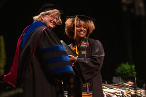 Professor Brenda Beerntsen presented diplomas to 14 students who earned a bachelor’s degree in microbiology.