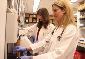 Dr. Carol Reinero (left) and Dr. Laura Nafe at work in the Comparative Internal Medicine Laboratory.