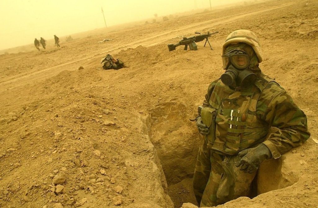 Hansen posing while on deployment in Iraq.