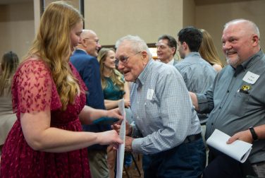 CVM alum George Fischer, DVM, ’52, and his son, Fred Fischer, greet Paige Isensee, who received the Carl Frederick Fischer and George Franklin Fischer Veterinary Medicine Scholarship.