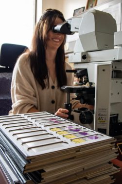 Smith analyzing a sample under a microscope. Reagan Manis / University of Missouri