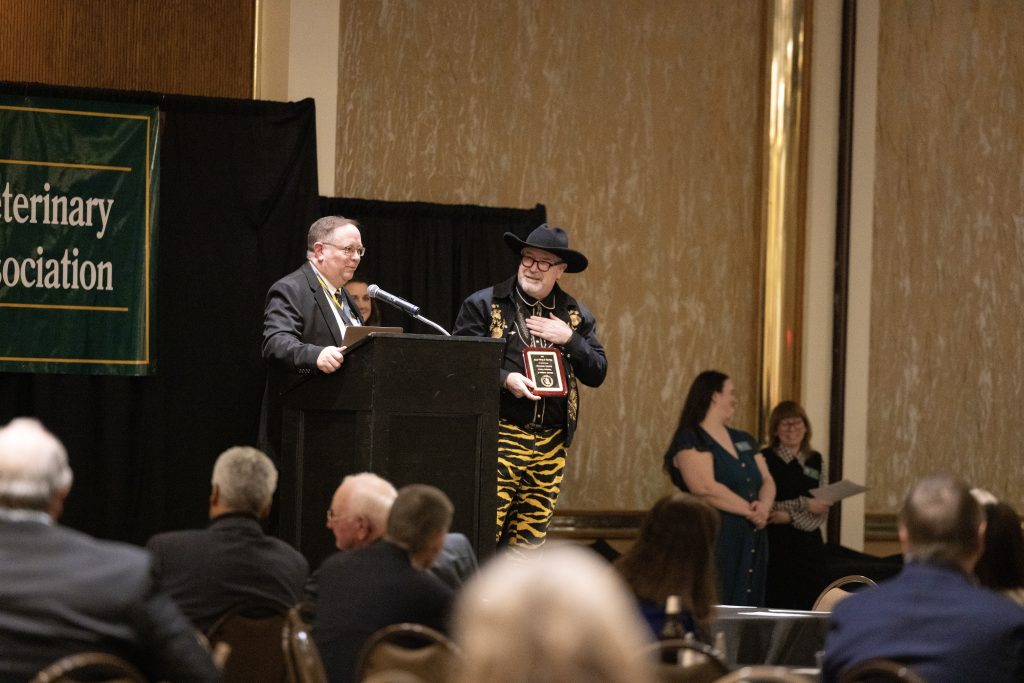 Dr. Evans accepts his award