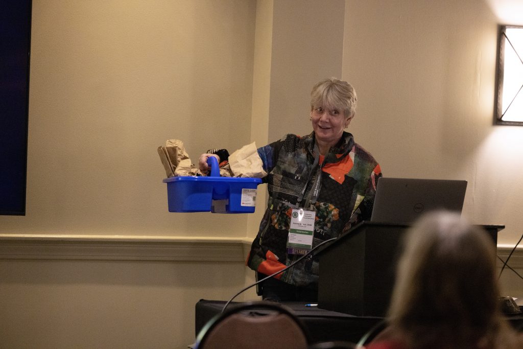 Dr. Kramer holds up some samples