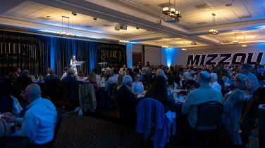 wide shot of the room full of people