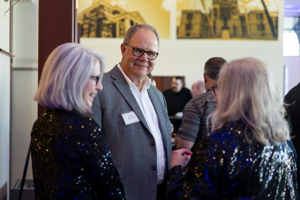 event-goers chat and smile