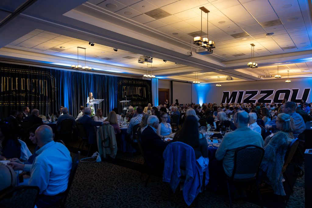 wide shot of the room full of people