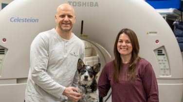 Kevin and Joni Lunceford in front of the PET-CT scanner.