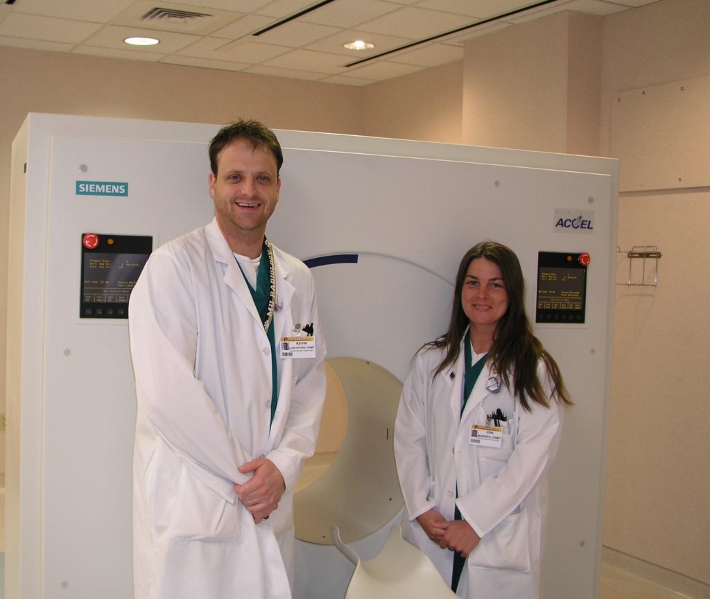 Kevin and Joni Lunceford in front of the college’s first dedicated PET scanner located at MU Health Care,