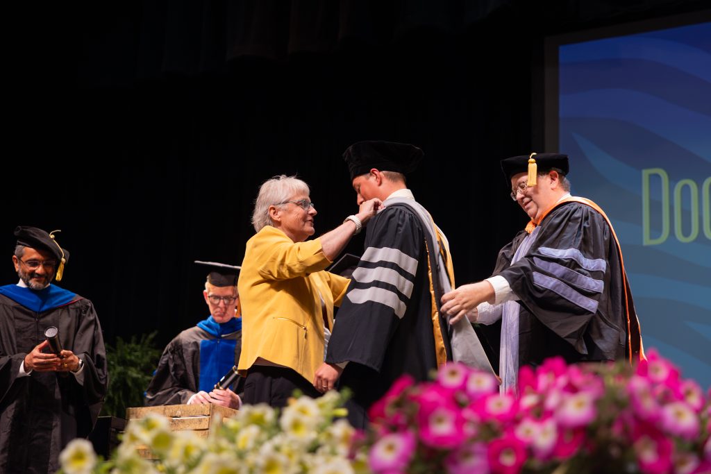 a student gets hooded 