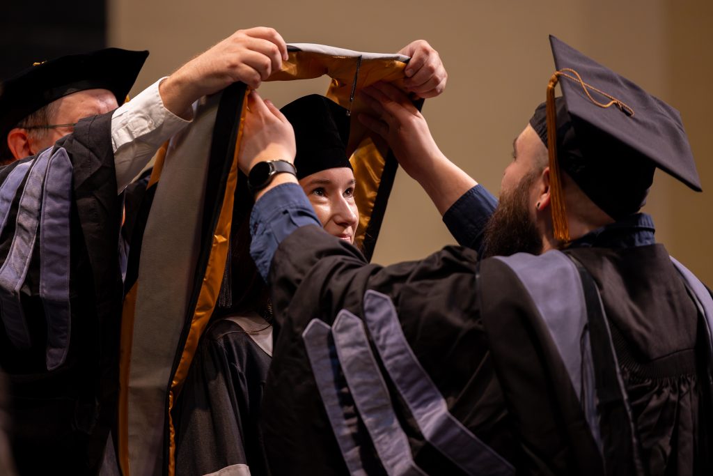 a female gets hooded