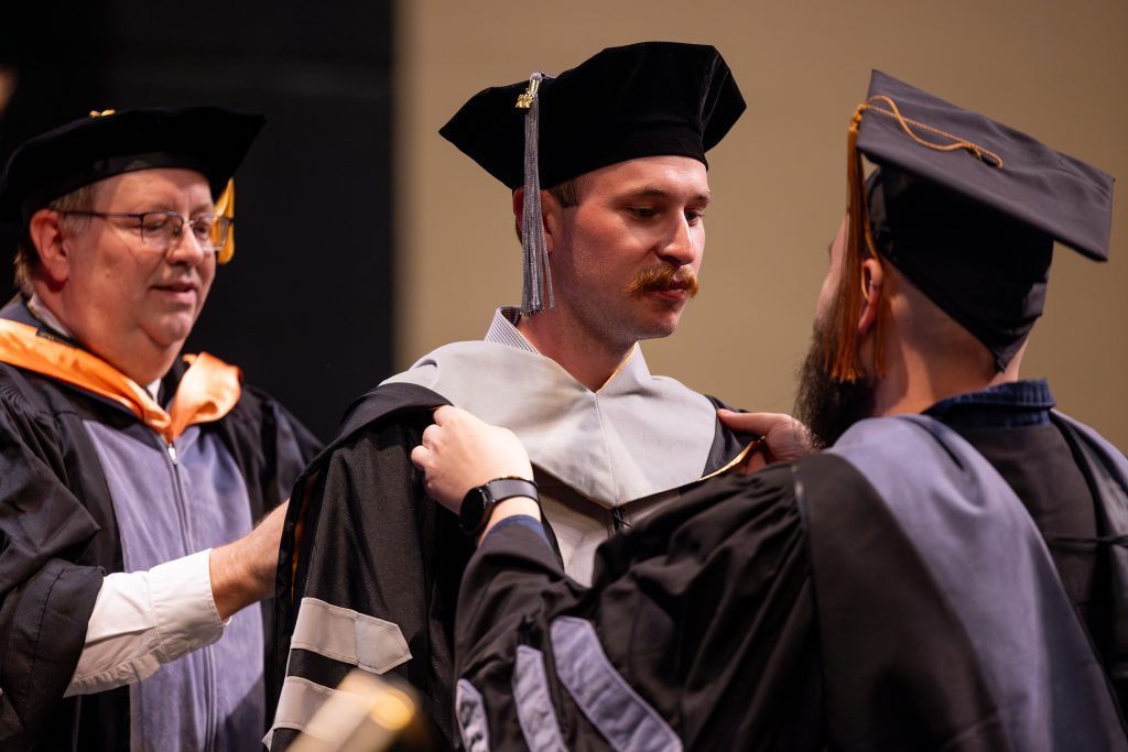 a man gets hooded