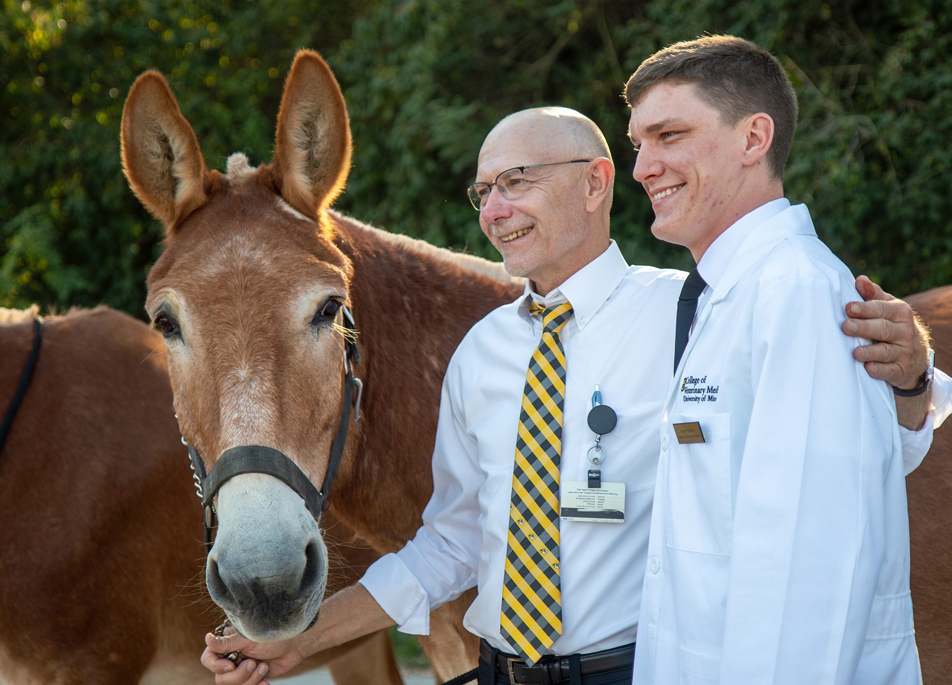 tim, dr. dodam and a student after the white coat ceremony
