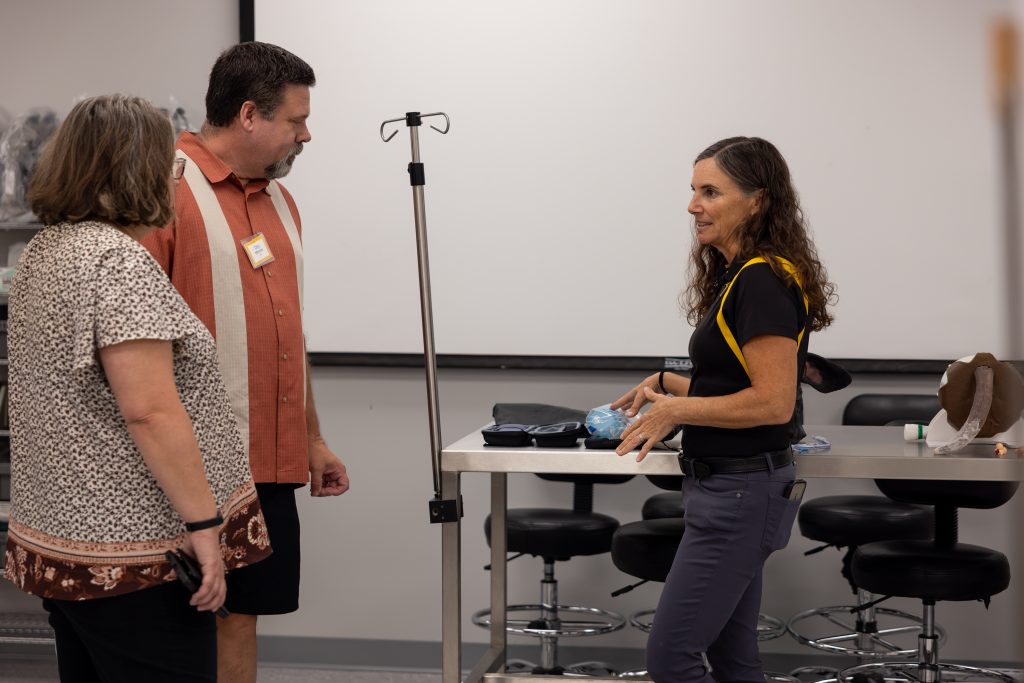 Dr. LaCarrubba talking to people in the Clinical Skills Lab
