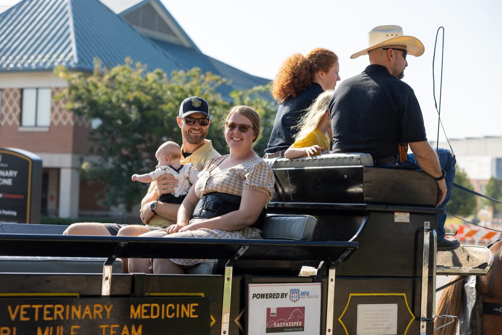 a family rides the mule wagon