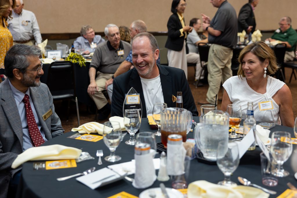 Curt Coffman, his wife and Dean Sri