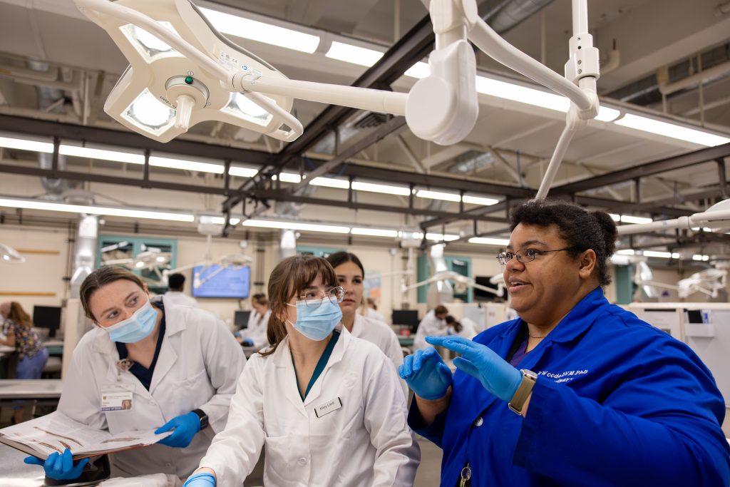 Rowena Woode instructing students in the lab.